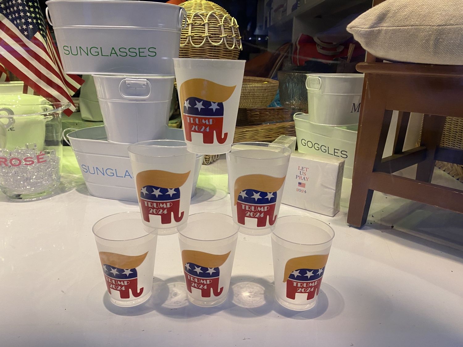 Cups bearing the former president's name, and hair, are for sale at the Monogram Shop. CHRISTOPHER WALSH