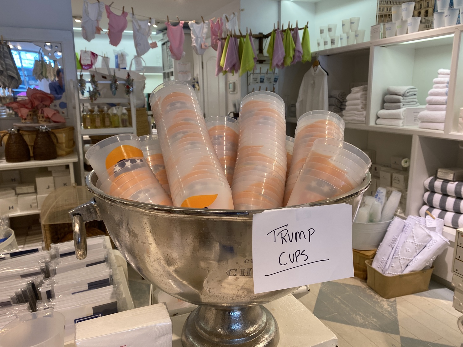 Unsold cups supporting former President Trump's candidacy overflowed at the Monogram Shop on Monday. CHRISTOPHER WALSH