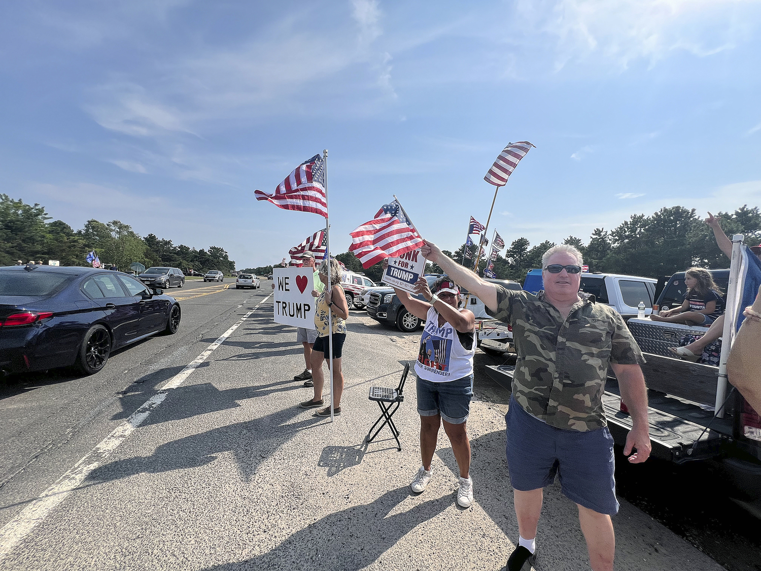 Supporters of former President Donald Trump lined a portion of Old Riverhead Road near Gabreski Airport in Westhampton Beach, waiting for hours to catch a glimpse of the passing motorcade. The former President's visit to the Bridgehampton home of Cantor Fitzgerald CEO Howard Lutnick for a campaign fundraiser. The visit brought traffic to a standstill across the east end for hours on Friday evening.  DANA SHAW