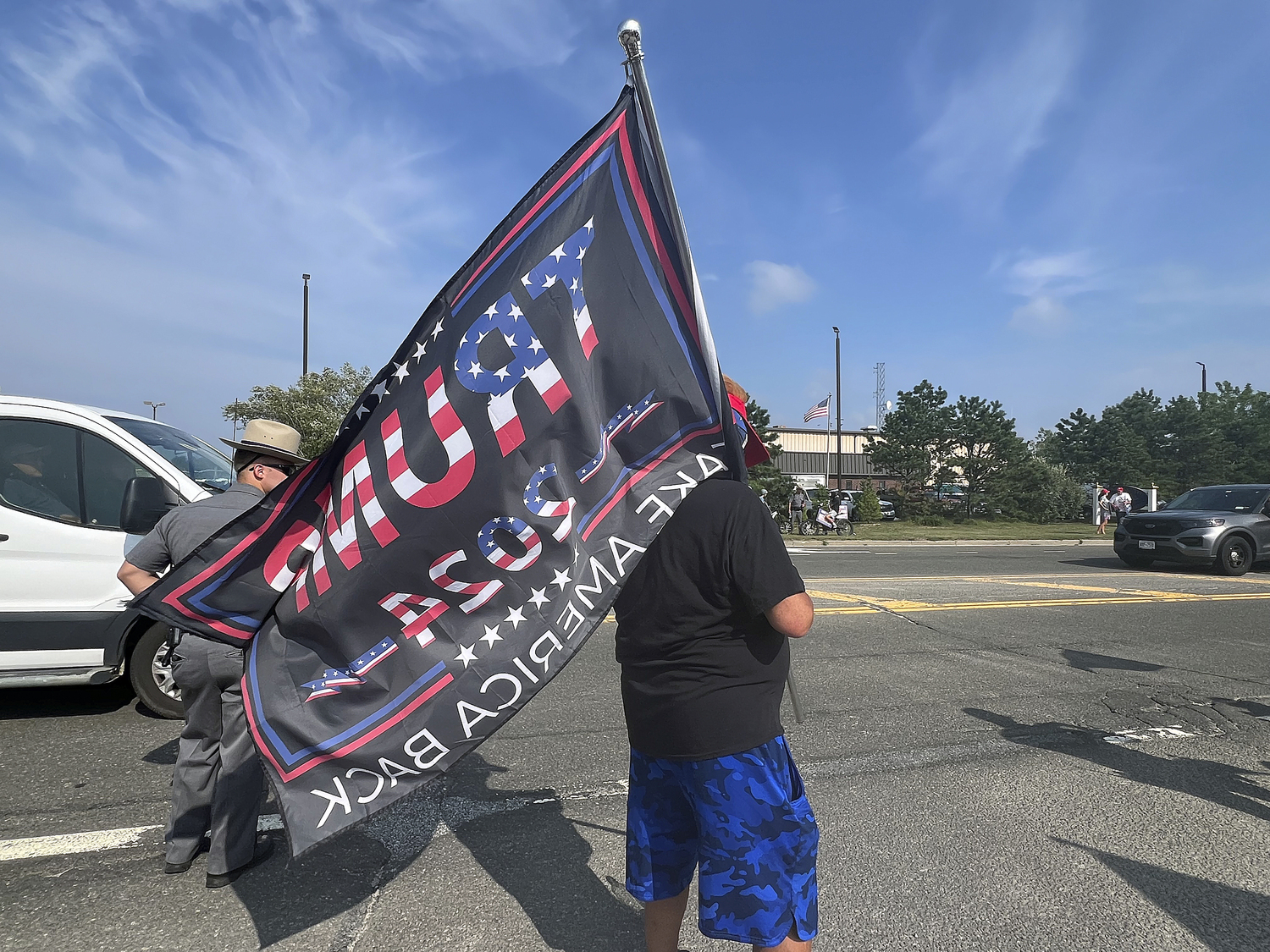 Supporters of former President Donald Trump lined a portion of Old Riverhead Road near Gabreski Airport in Westhampton Beach, waiting for hours to catch a glimpse of the passing motorcade. The former President's visit to the Bridgehampton home of Cantor Fitzgerald CEO Howard Lutnick for a campaign fundraiser. The visit brought traffic to a standstill across the east end for hours on Friday evening.  DANA SHAW