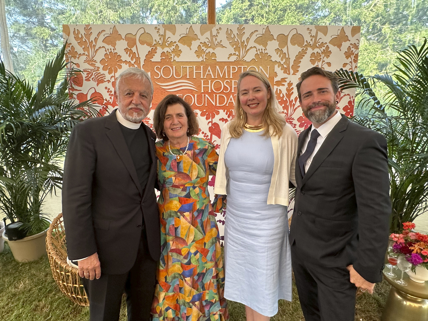 Father Alex and Xanthi Karloutsos with Emily Mastaler and Jon McAuliffe at the Hospital Summer Party.    GREGORY D'ELIA