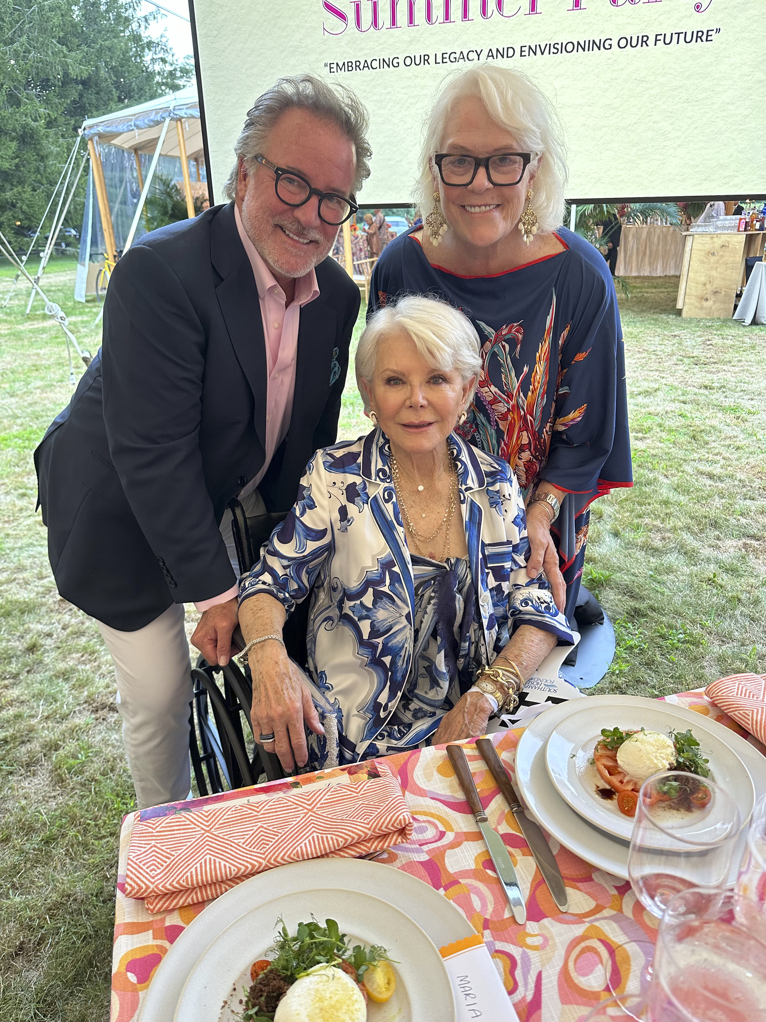 Kevin Maple, Nancy Stone, seated, and Sally Van Erk at the Hospital Summer Party.  GREGORY D'ELIA