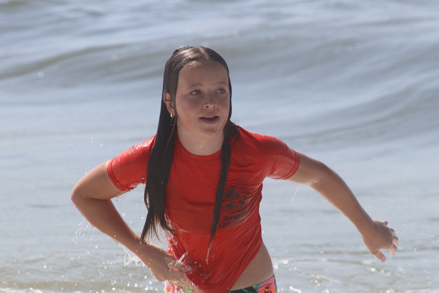 Isla McMahon of Hampton Bays in the distance swim.  CAILIN RILEY