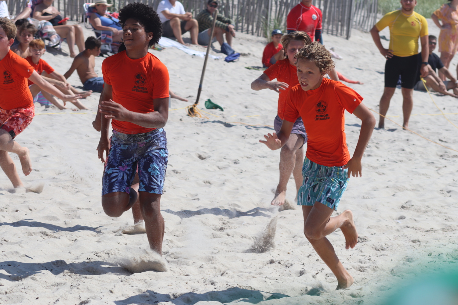 East Quogue resident Landon King, right, in beach flags. CAILIN RILEY