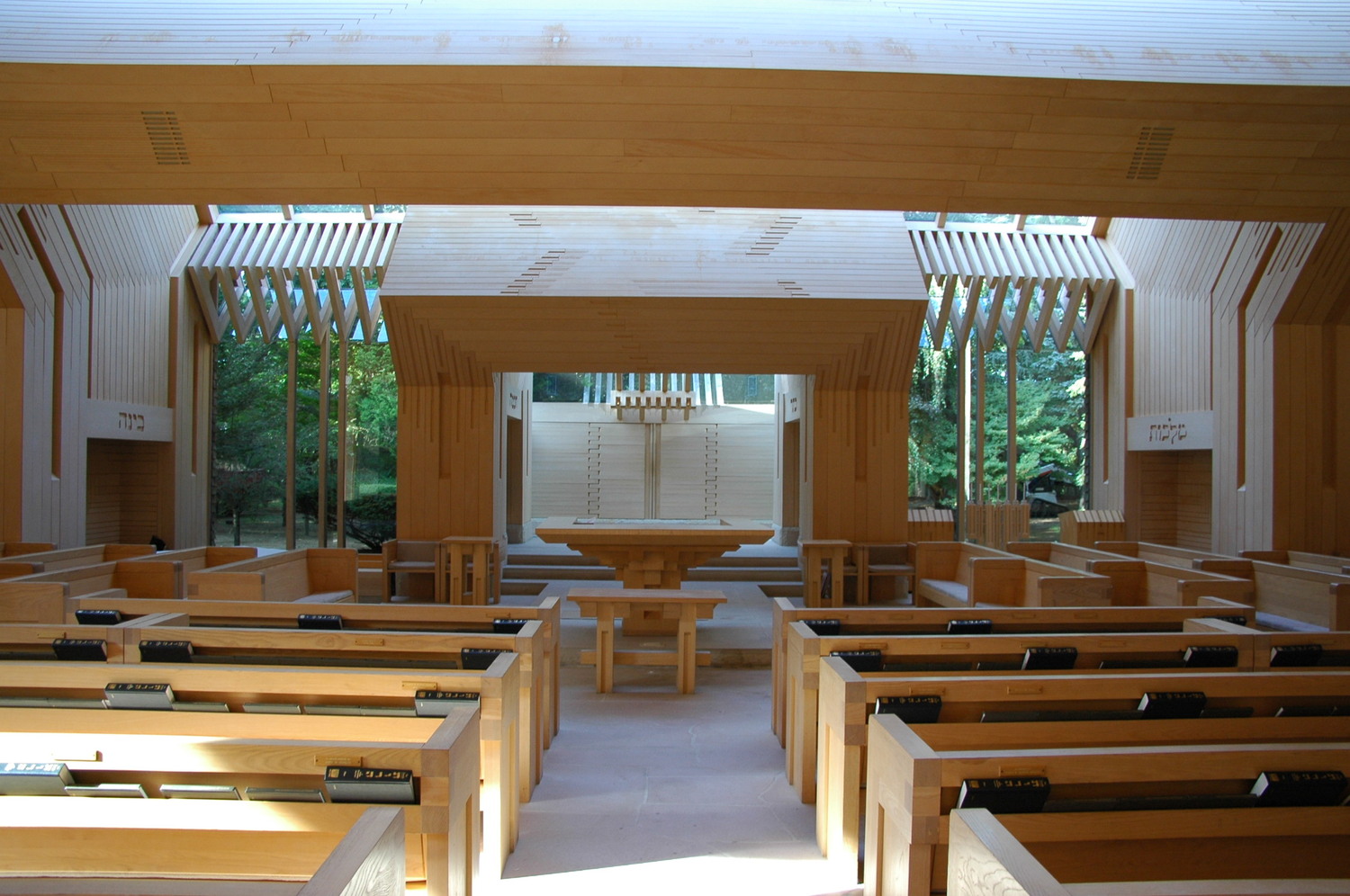 The Jewish Center of the Hamptons sanctuary showing the bema table and the Star of David carved into the wall above the ark.  ANNE SURCHIN