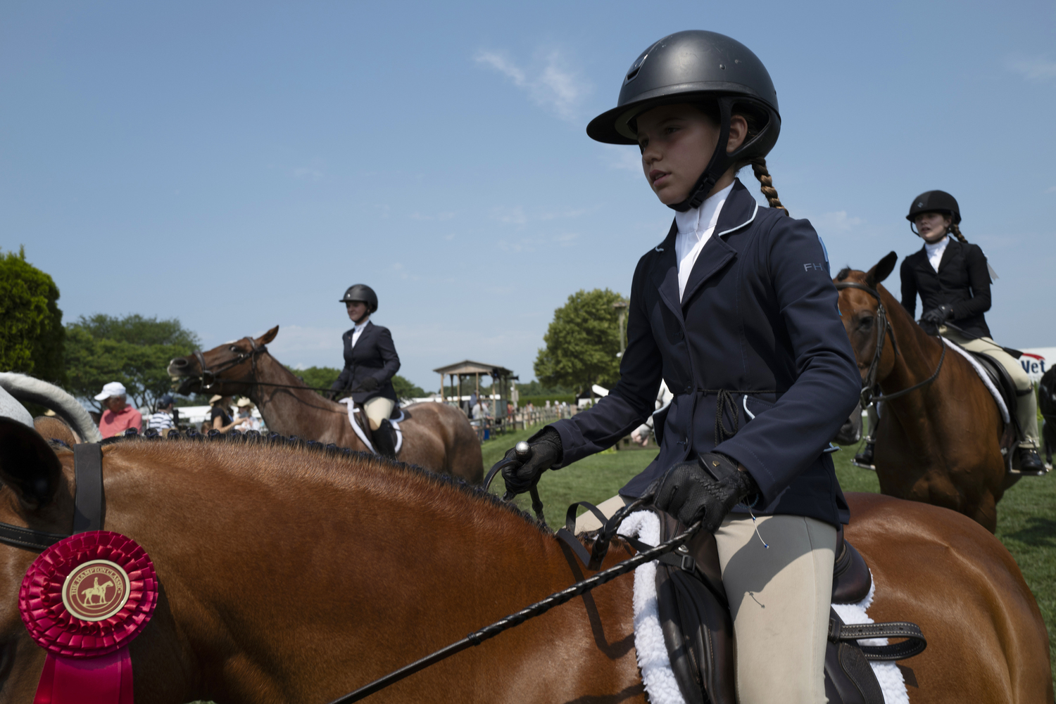 Lexie Tucci with her second place ribbon on her pony Windsor.   LORI HAWKINS