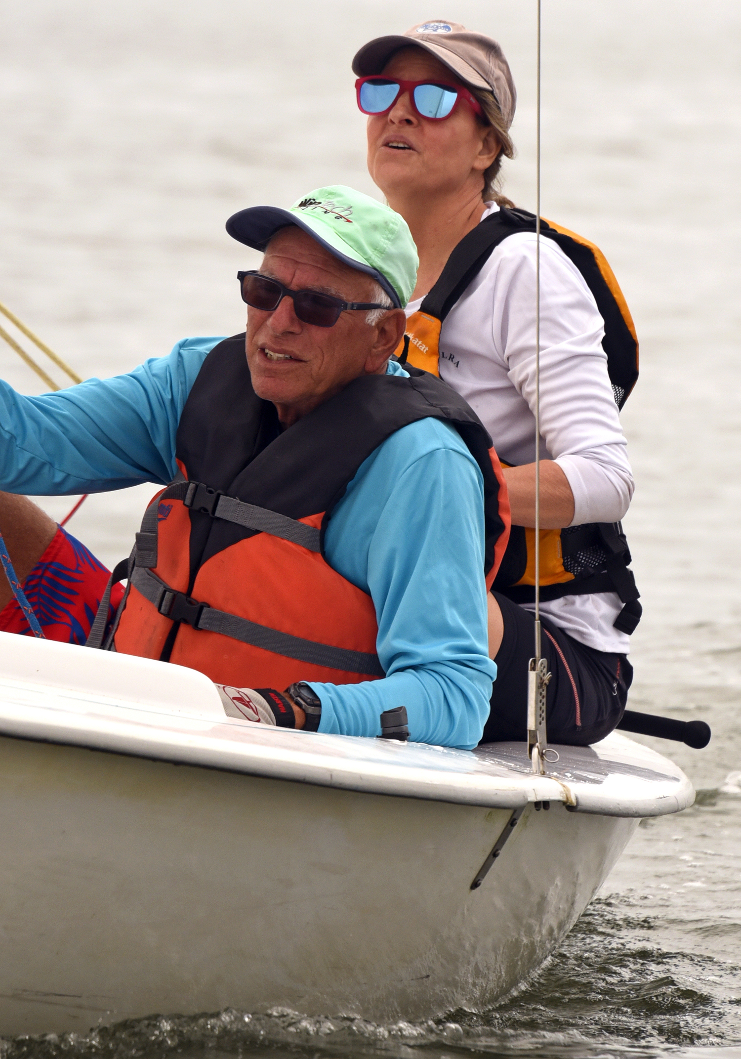 Sarah Alford and Lee Oldak, the skipper of lightning fast Wednesday Night Racing sloop Purple Haze, focuses on the finish line in the first race. MICHAEL MELLA