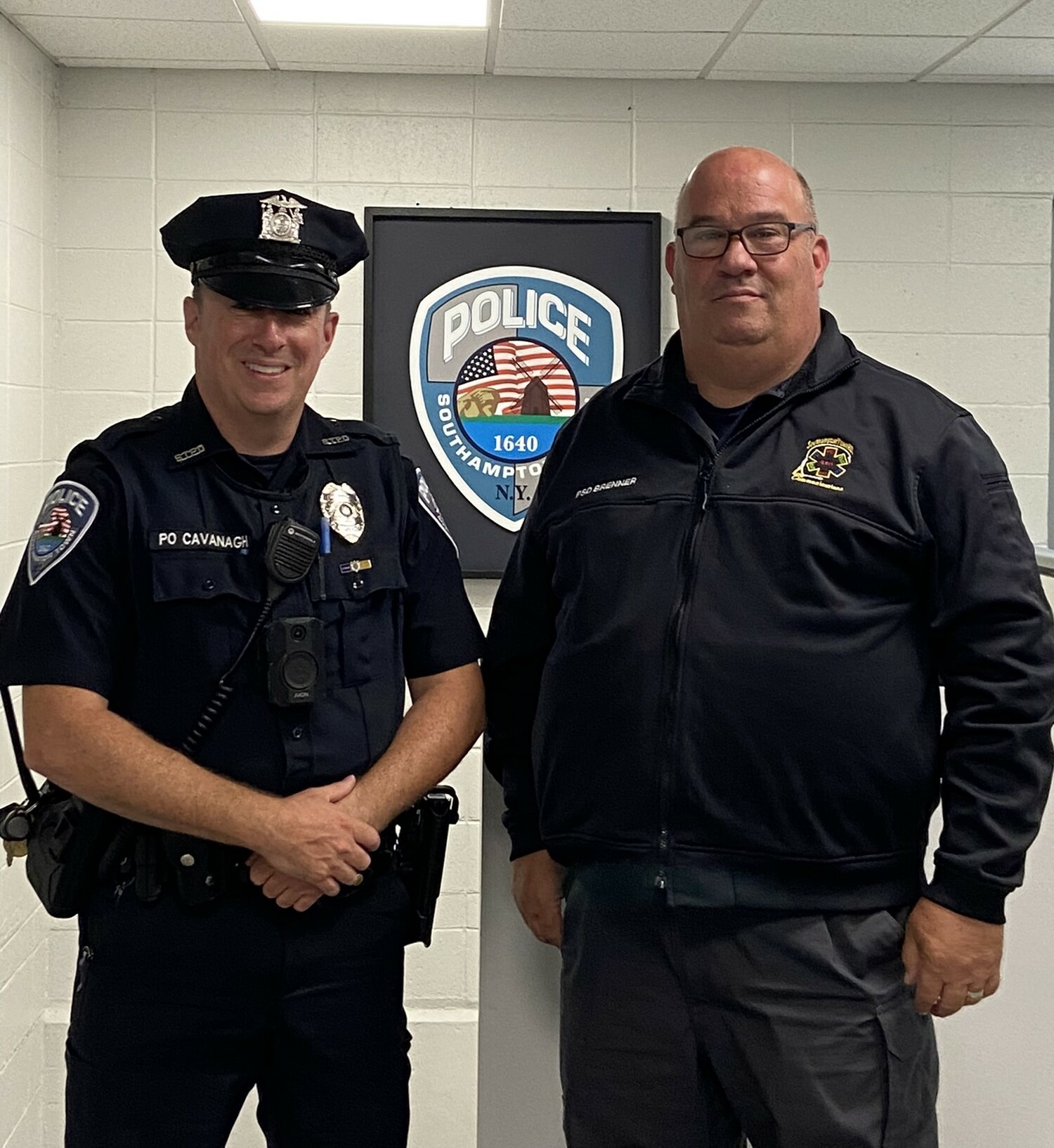 Officer James Cavanagh, who arrived at the Flanders home just as the baby was born, and Public Safety Dispatcher Chris Brenner who had talked the 12 year old boy through helping his aunt deliver the baby. COURTESY SOUTHAMPTON TOWN POLICE