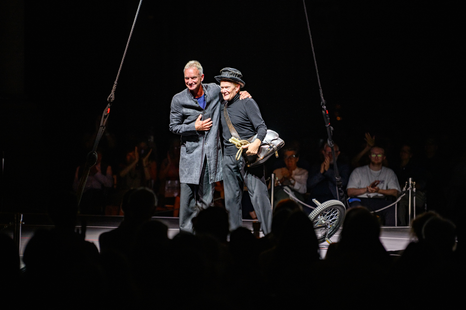 Philippe Petit and Sting take a bow during a performance of 