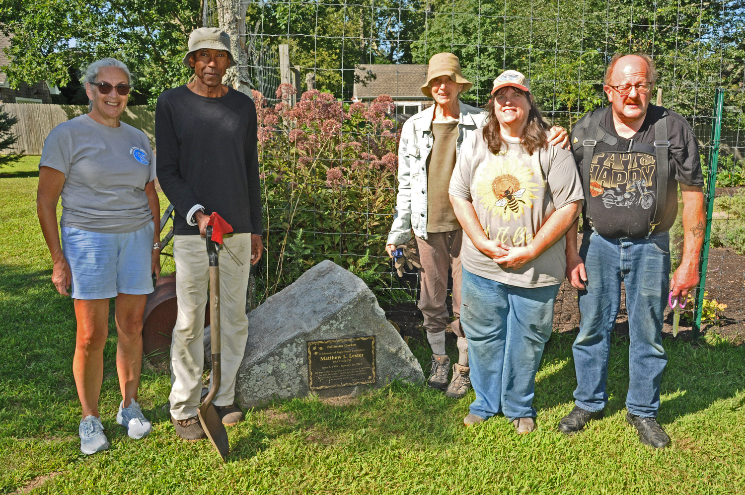 Patty Sales, Len Green, Nancy Erber, Dana Lester and Jeff Lester at the East Hampton Town Historical Farm Museum on August 2 where they joined with ReWild Long Island and members of the community to restore the pollinator garden  designed by Matthew L. Lester who lost his life in 2017.      RICHARD LEWIN