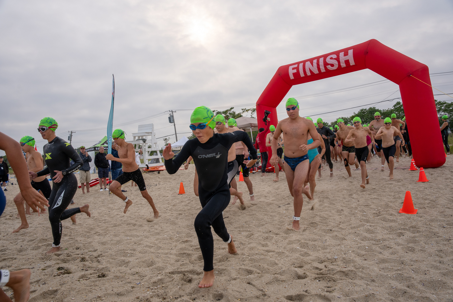 Participants head into the water at Long Beach in Sag Harbor for Saturday's swim.   RON ESPOSITO