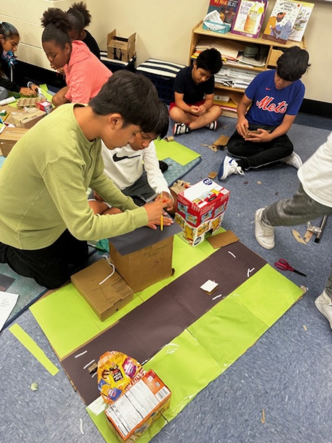 As part of a multidisciplinary project, fifth and sixth grade Southampton Intermediate School Summer Academy students worked collaboratively to research renewable energy and build and present “green cities” that showcased what they had learned. Their cities included electric cars, rooftop gardens, and wind, hydro and solar power, as well as green spaces, from walkways to bike paths. Their project was inspired by a reading of “Green City” by Allan Drummond, which discusses a town that was hit by a
tornado and rebuilt using sustainable energy. COURTESY SOUTHAMPTON SCHOOL DISTRICT