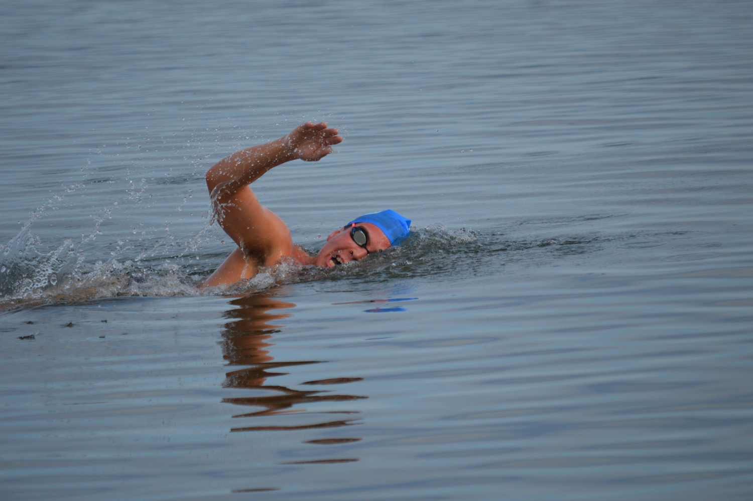 A.J. Mungo swims to the finish line as the winner of the 1-mile race. GAVIN MENU