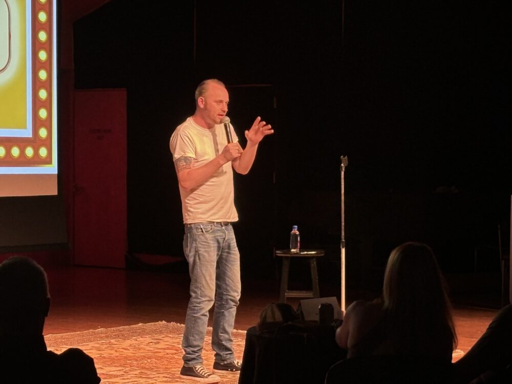 Joe Winchell on stage at Sticks and Stones Comedy Club. COURTESY ABBY RUSSELL