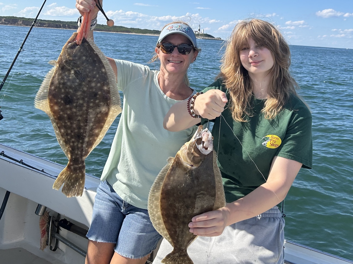 Diane and Meriel Curtin with a pair of keeper fluke caught aboard the Montauk charter boat, Sarah Grace, on Labor Day. KITTY MERRILL