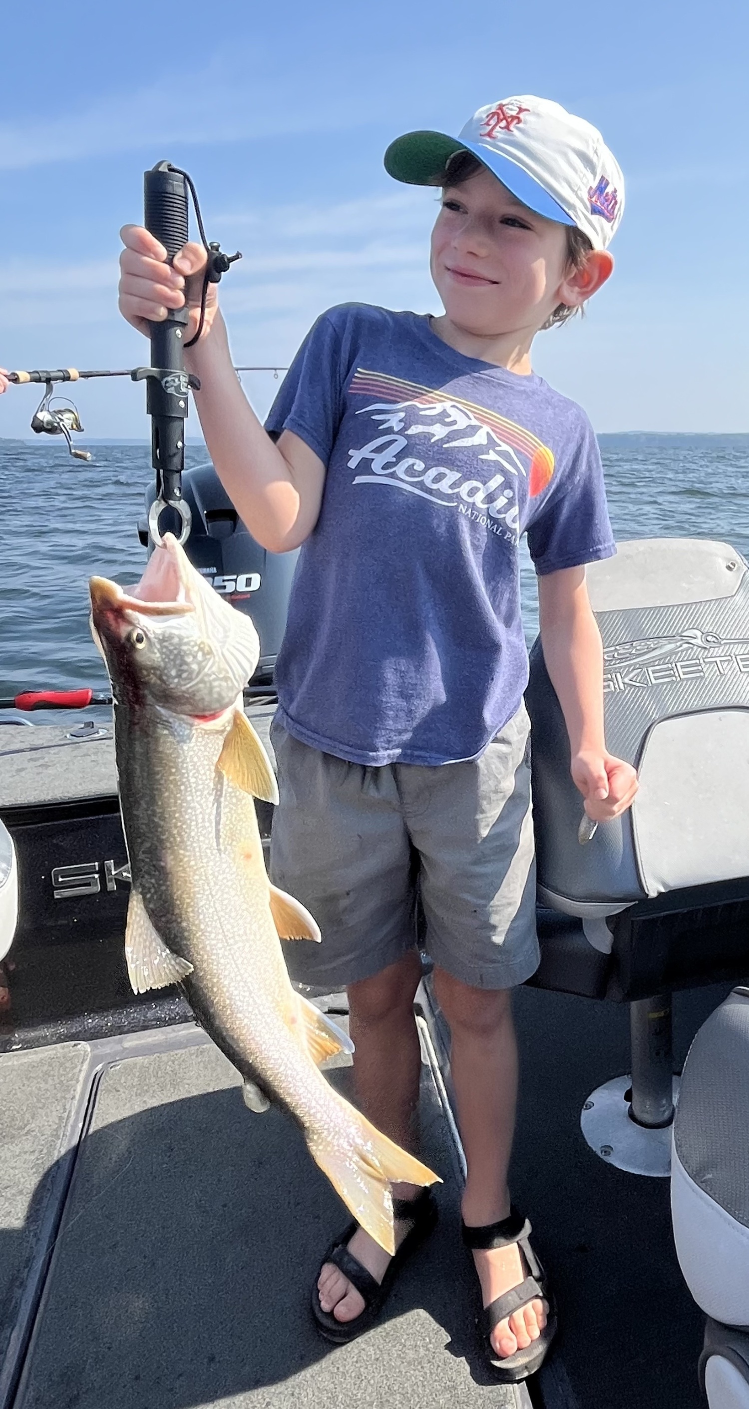 Aleksei Darvin caught this beautiful lake trout while fishing Lake Champlain with his family last week. TANYA PACHECO