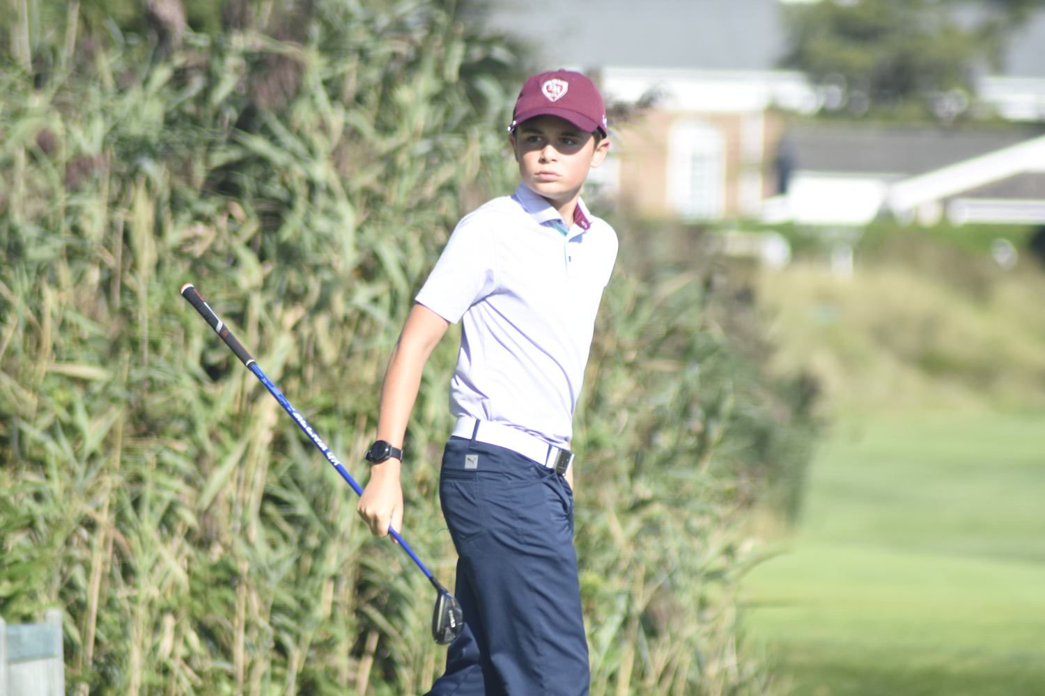 East Hampton eighth-grader Cole DeLand tees off at hole two at Westhampton Country Club.   DREW BUDD