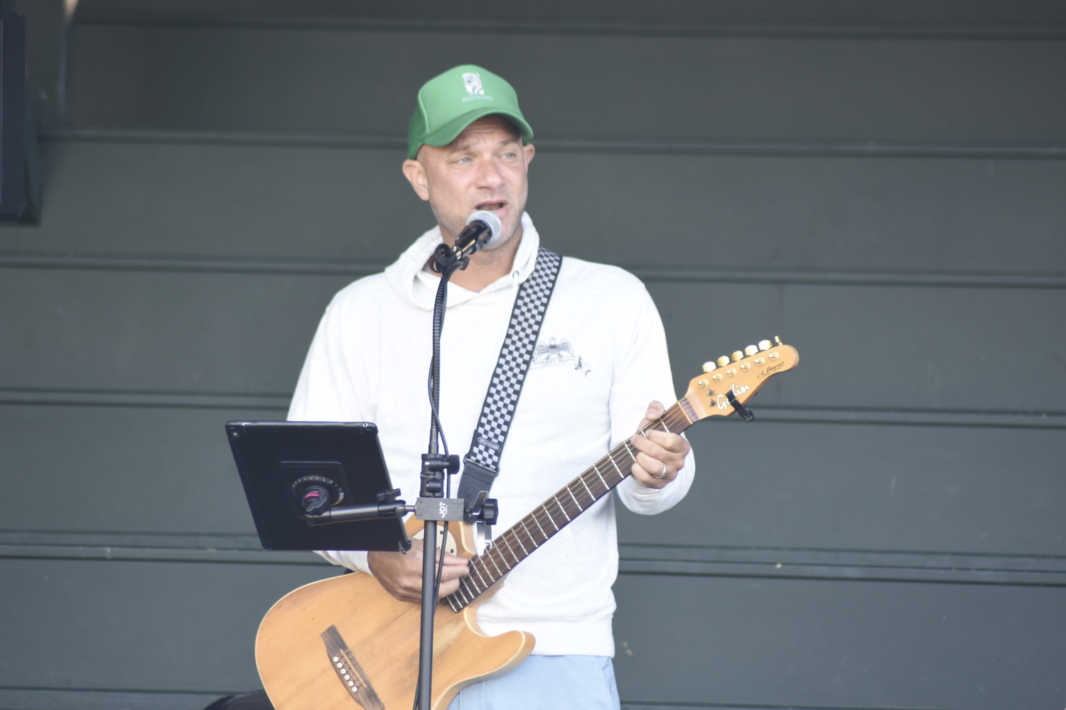 Josh Brussell serenades the early morning crowd with some smooth songs.   DREW BUDD