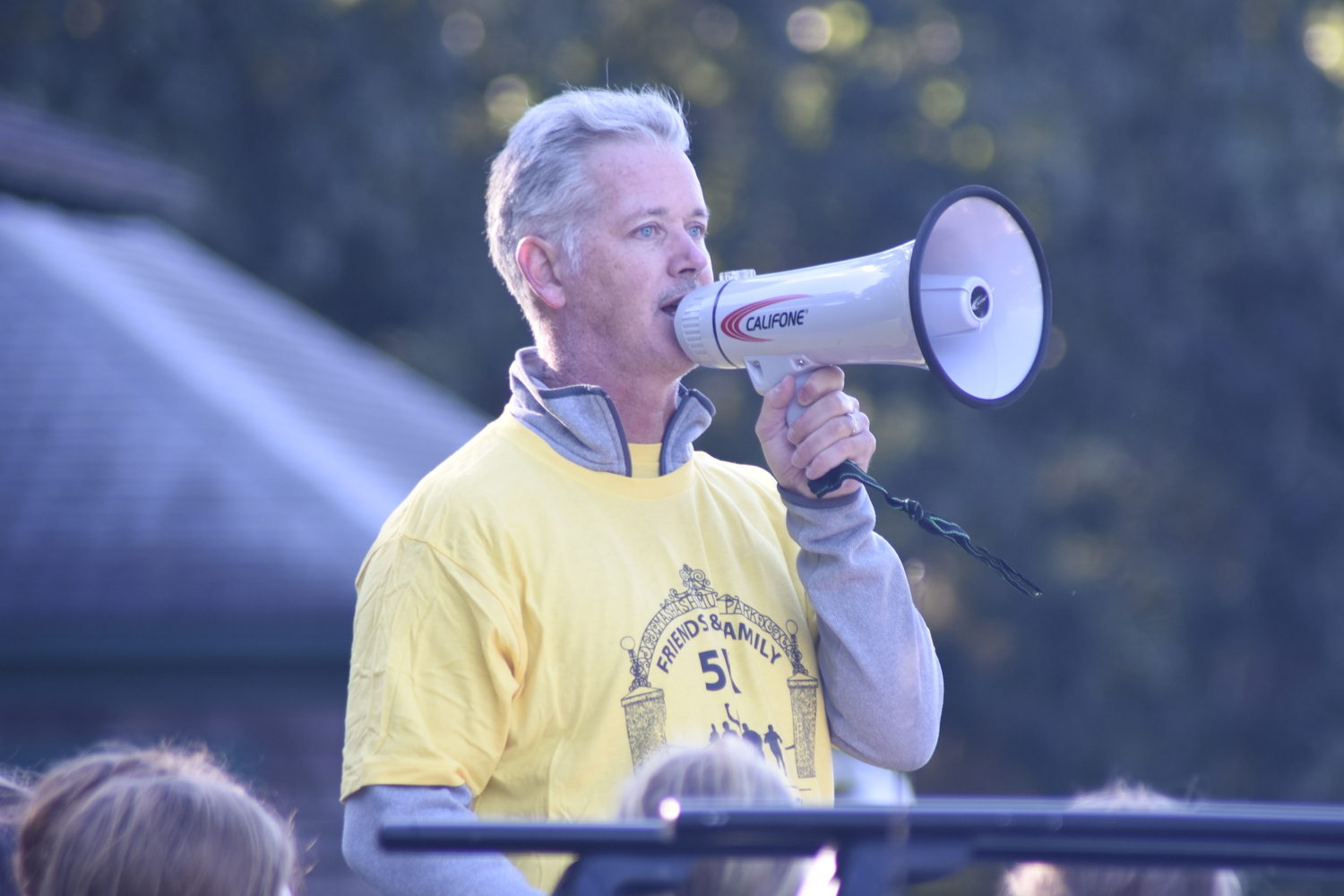 Michael Dee makes some announcements just prior to Sunday morning's race.   DREW BUDD