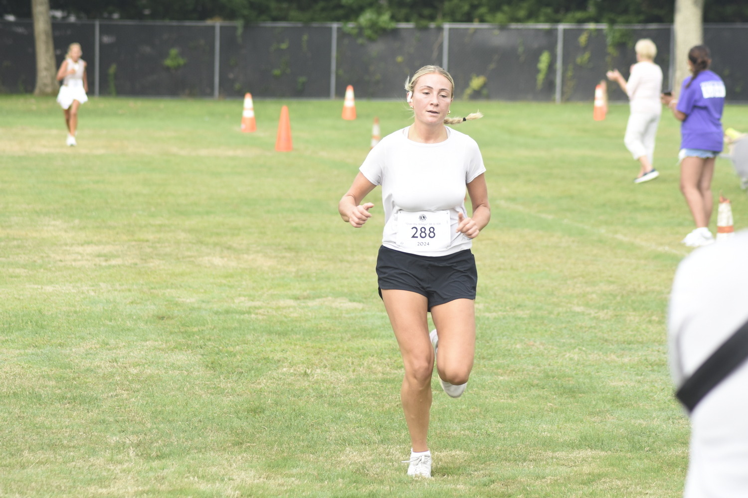 Isabelle Smith placed second among women in Saturday morning's 5K.   DREW BUDD