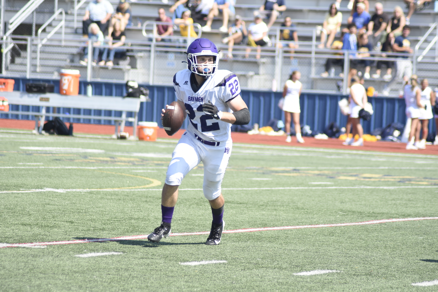 Nate Donahue rolls to his right looking for an open receiver.   DREW BUDD