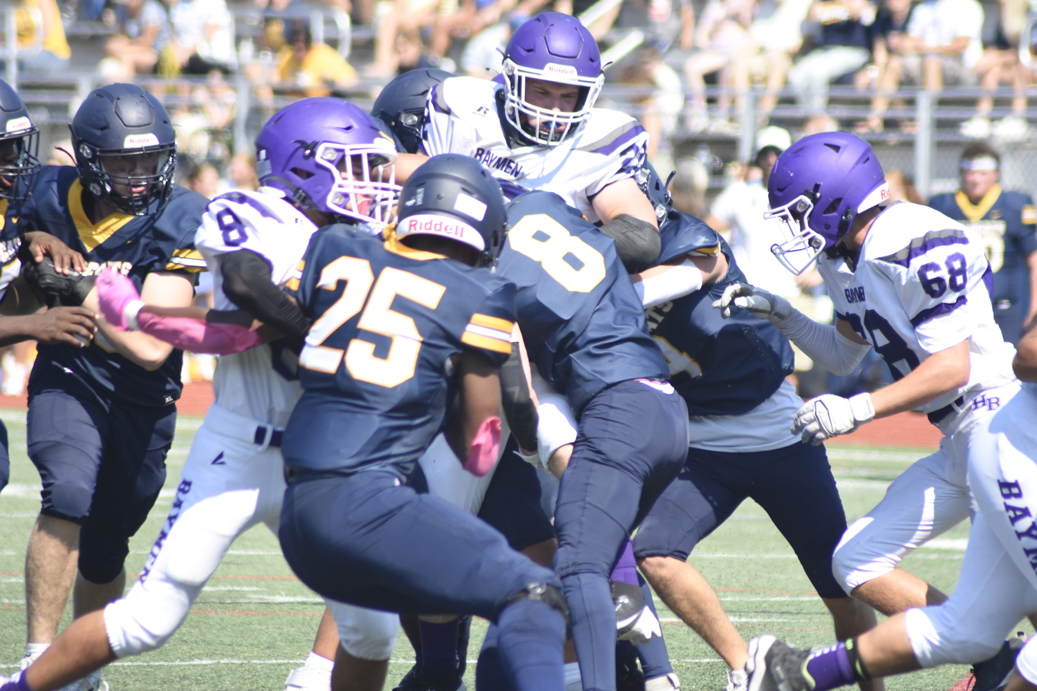 Nate Donahue tries to gain some yards but is stood up by the Wildcats defense.   DREW BUDD