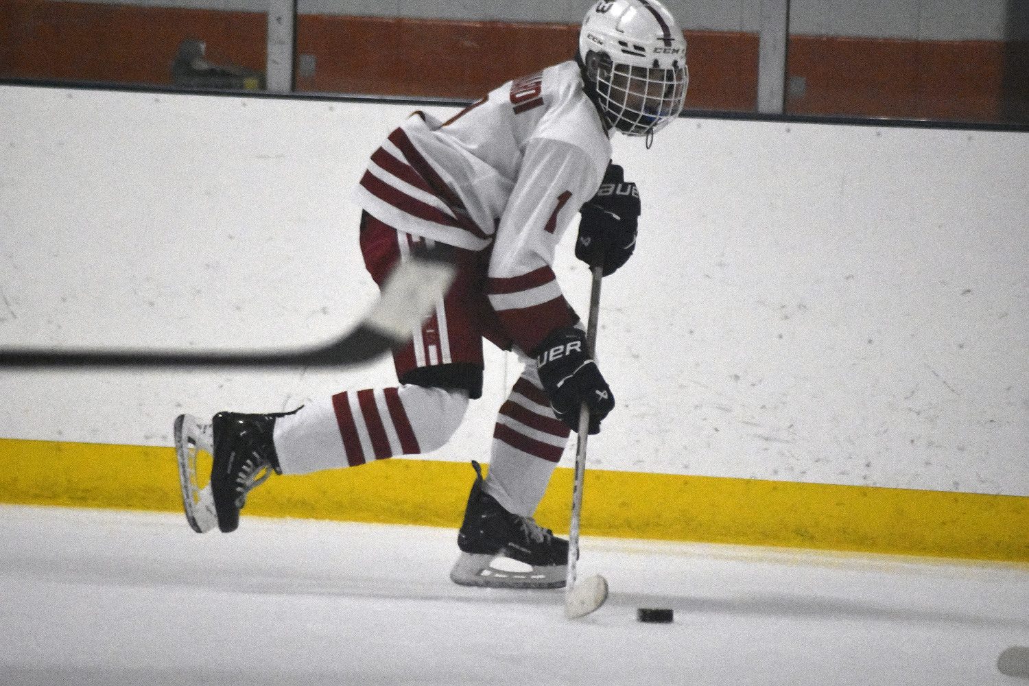 Cam Minardi races the puck down the ice.   DREW BUDD