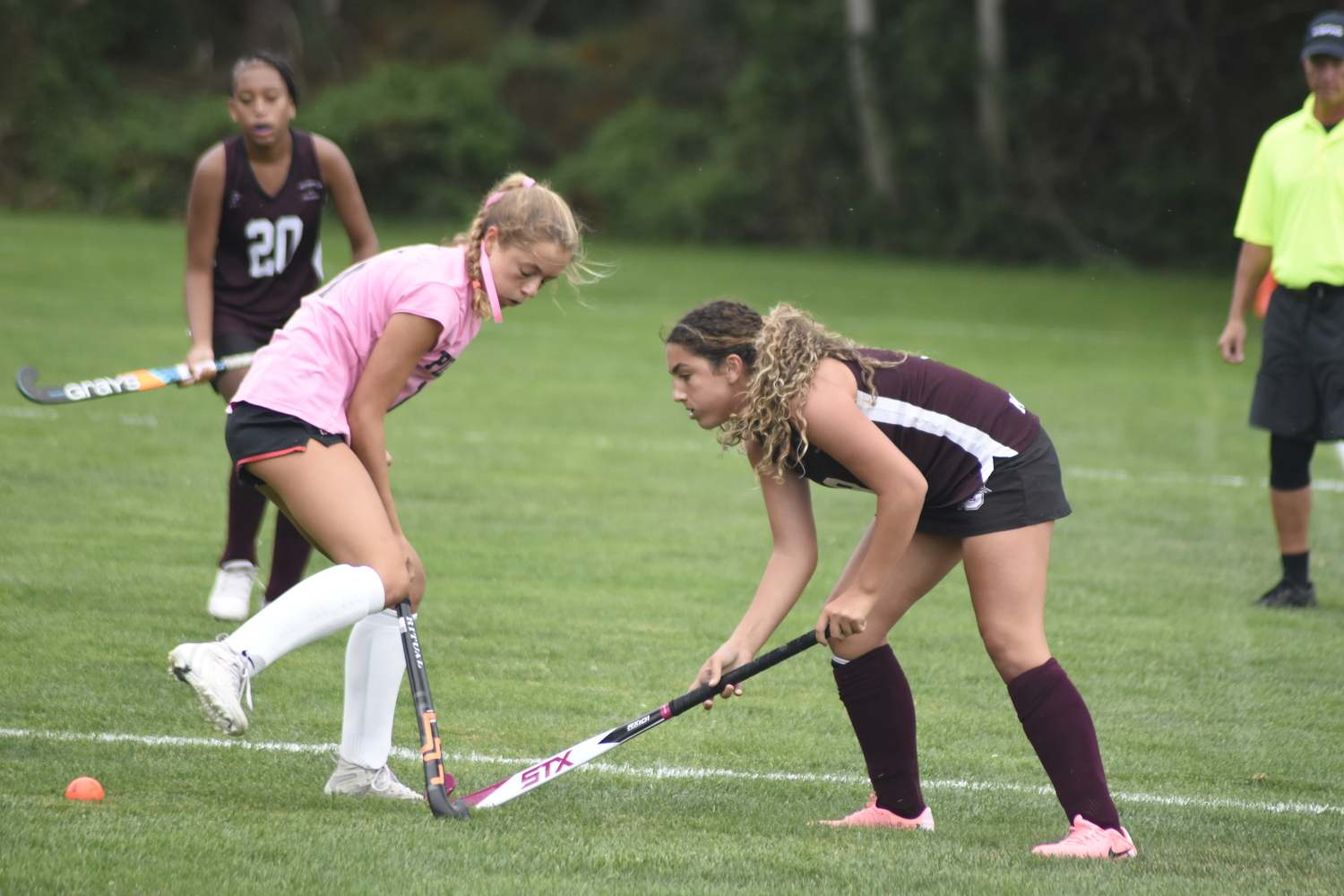 Southampton freshman Malu Garcia hits the ball near the feet of Pierson junior Clio Halweil.   DREW BUDD