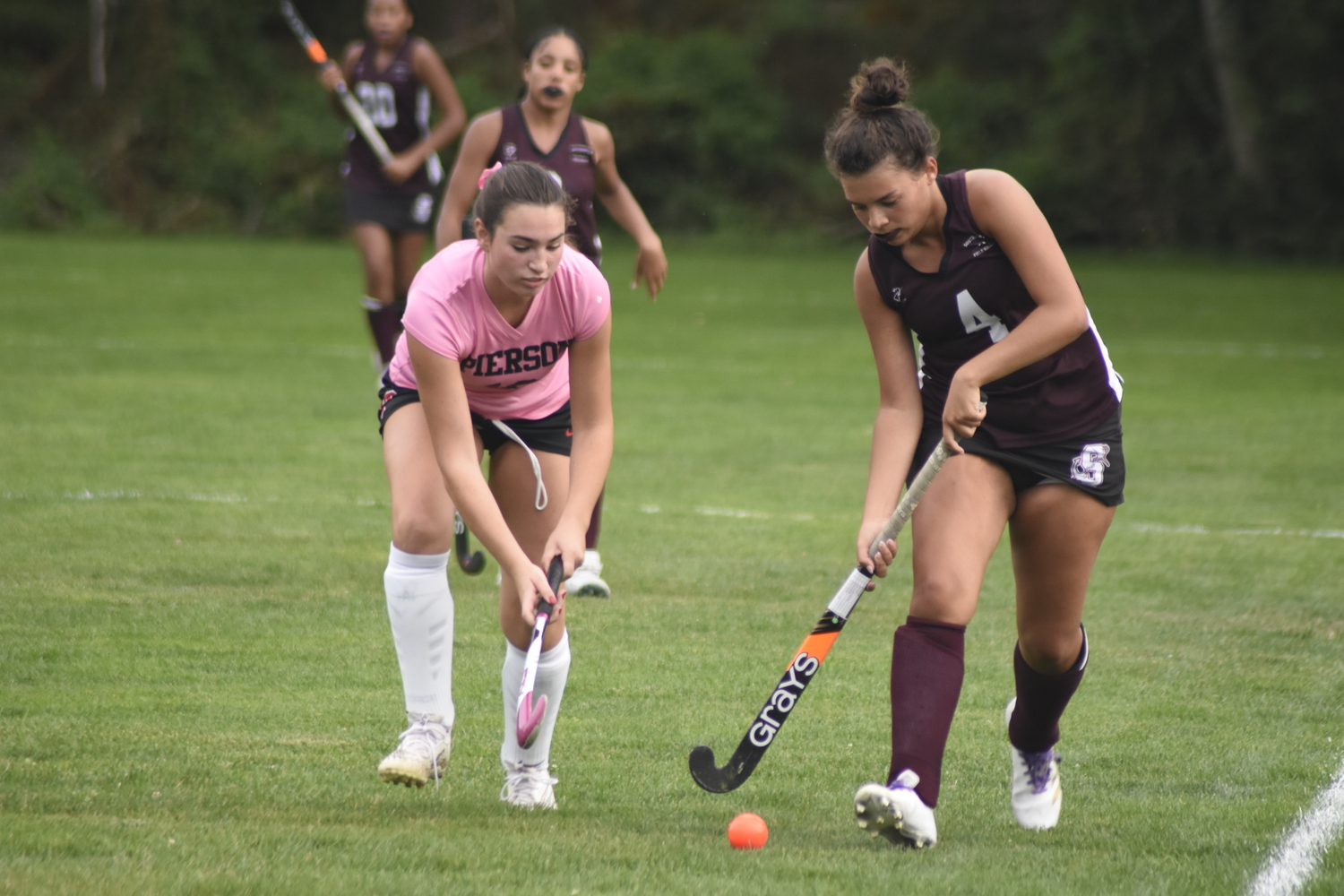 Pierson freshman Grayson Knapik trails Southampton senior Anabella Arnold on the sideline.   DREW BUDD