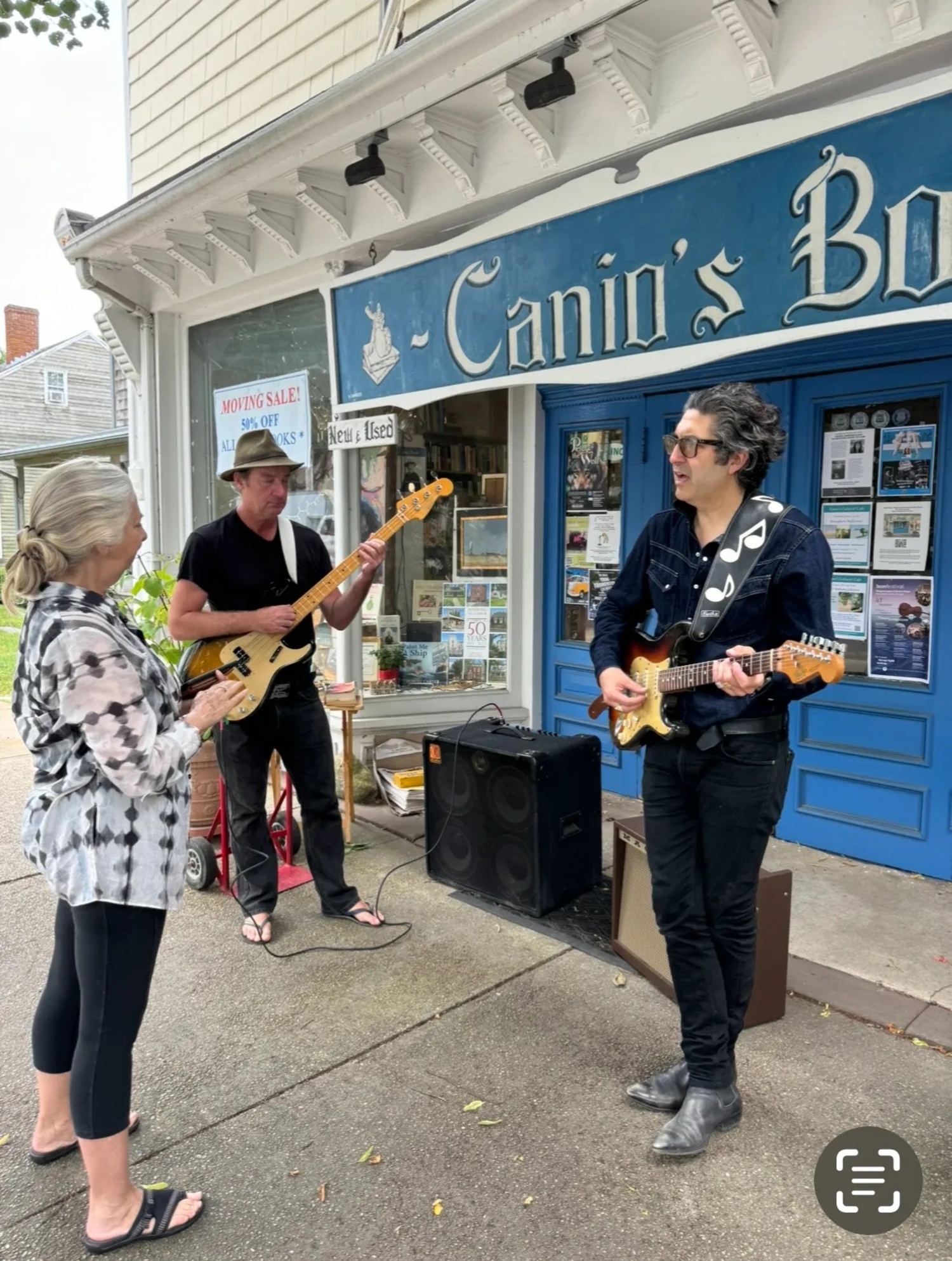 Poster Artist Barbara Maslen talking with musicians ake Lear and Jameson Ellis at Canio's Books. COURTESY SHAMF