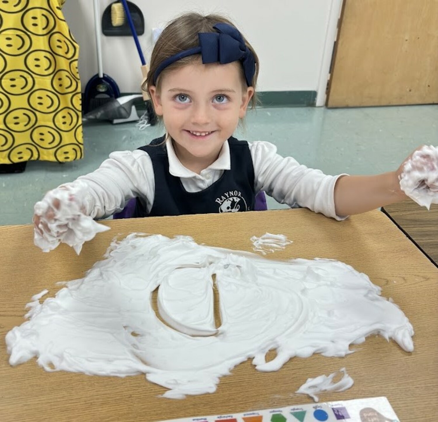 Raynor Country Day School kindergartners Aamani Mandel and Charlotte Burkly loved the fun hands-on writing lesson that involved shaving cream. The sensory material was an exciting canvas to practice properly forming uppercase and lowercase letters, as well as sight words.  COURTESY  RAYNOR COUNTRY DAY SCHOOL