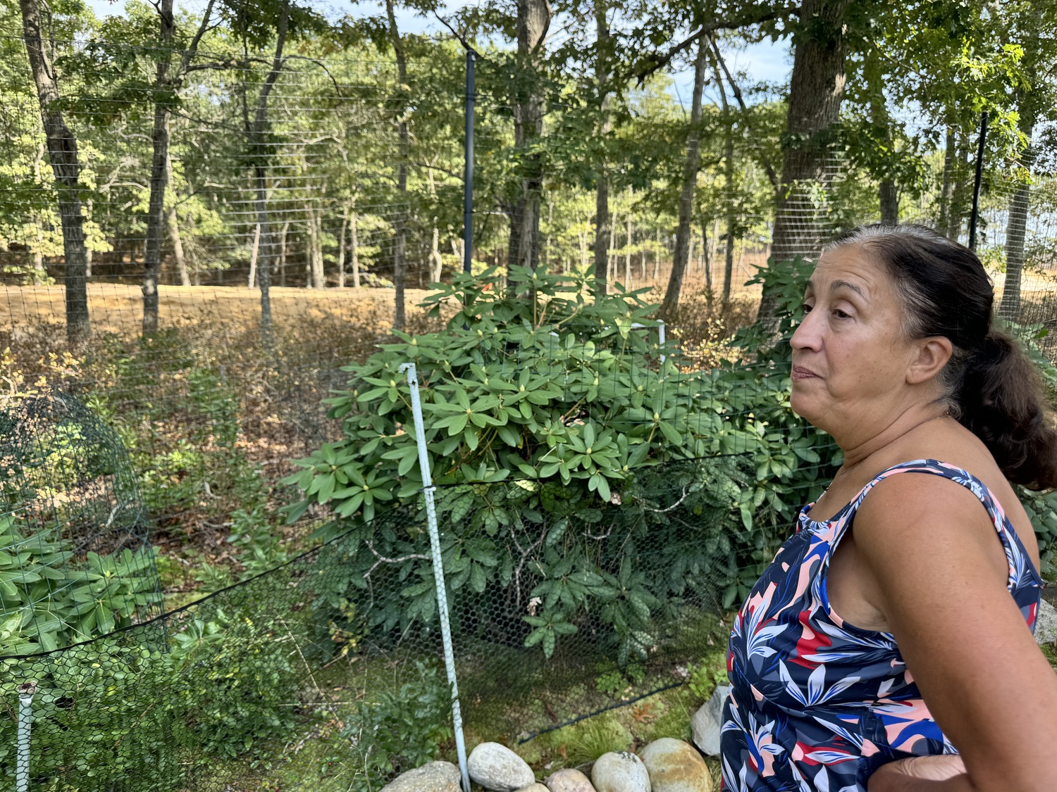 Carol McNeil's backyard sits just yards from the access road being built into the property where the Shinnecock Nation plans to open a gas station. She has installed a seismograph to measure the shaking of the ground on her property by the construction equipment.