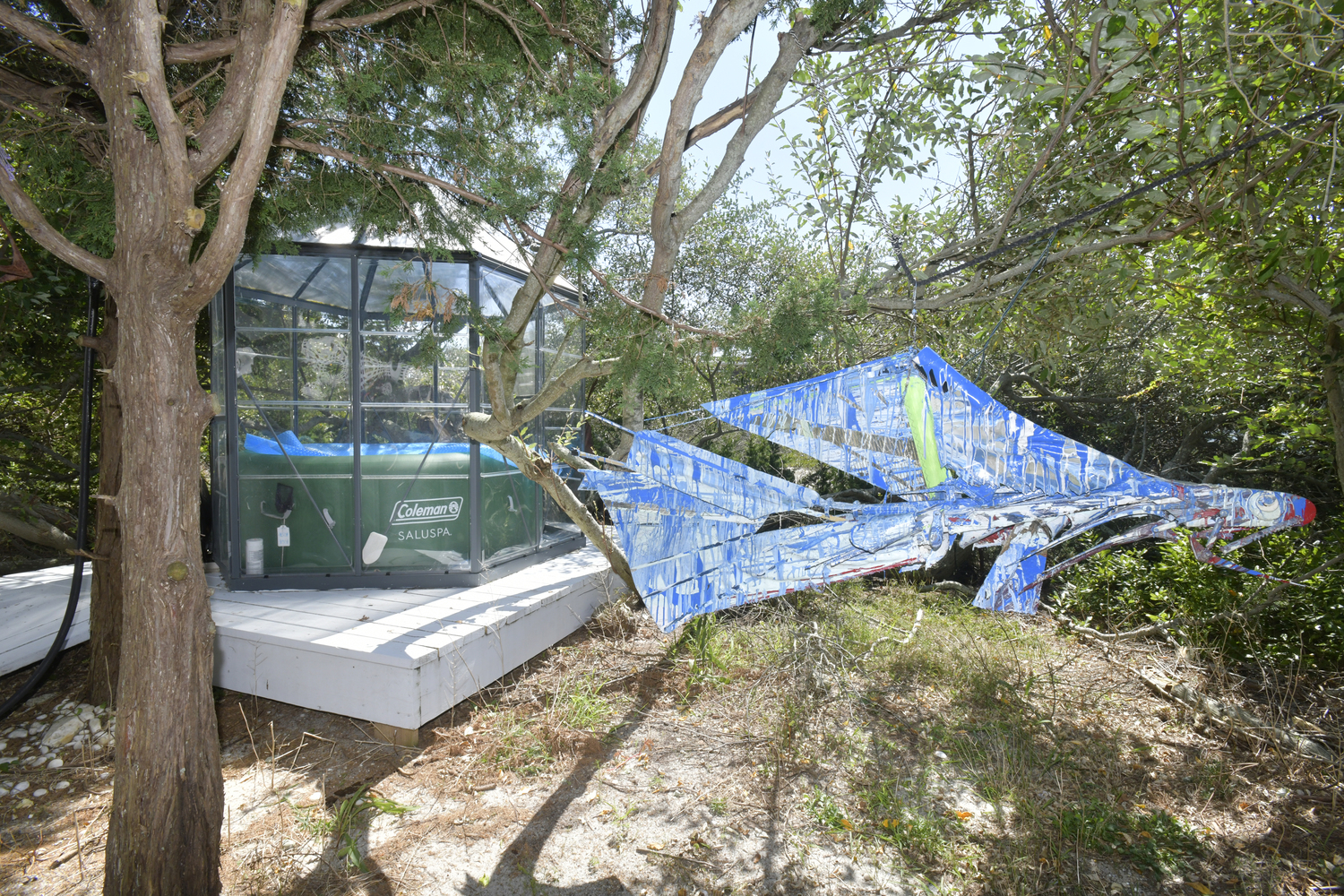 The front yard could be considered an outdoor art gallery where Dixon’s fish mobiles sway gently with the wind. The collection of colorful objects represent the marine life that Dixon craves, from fish to sailboats.  DANA SHAW