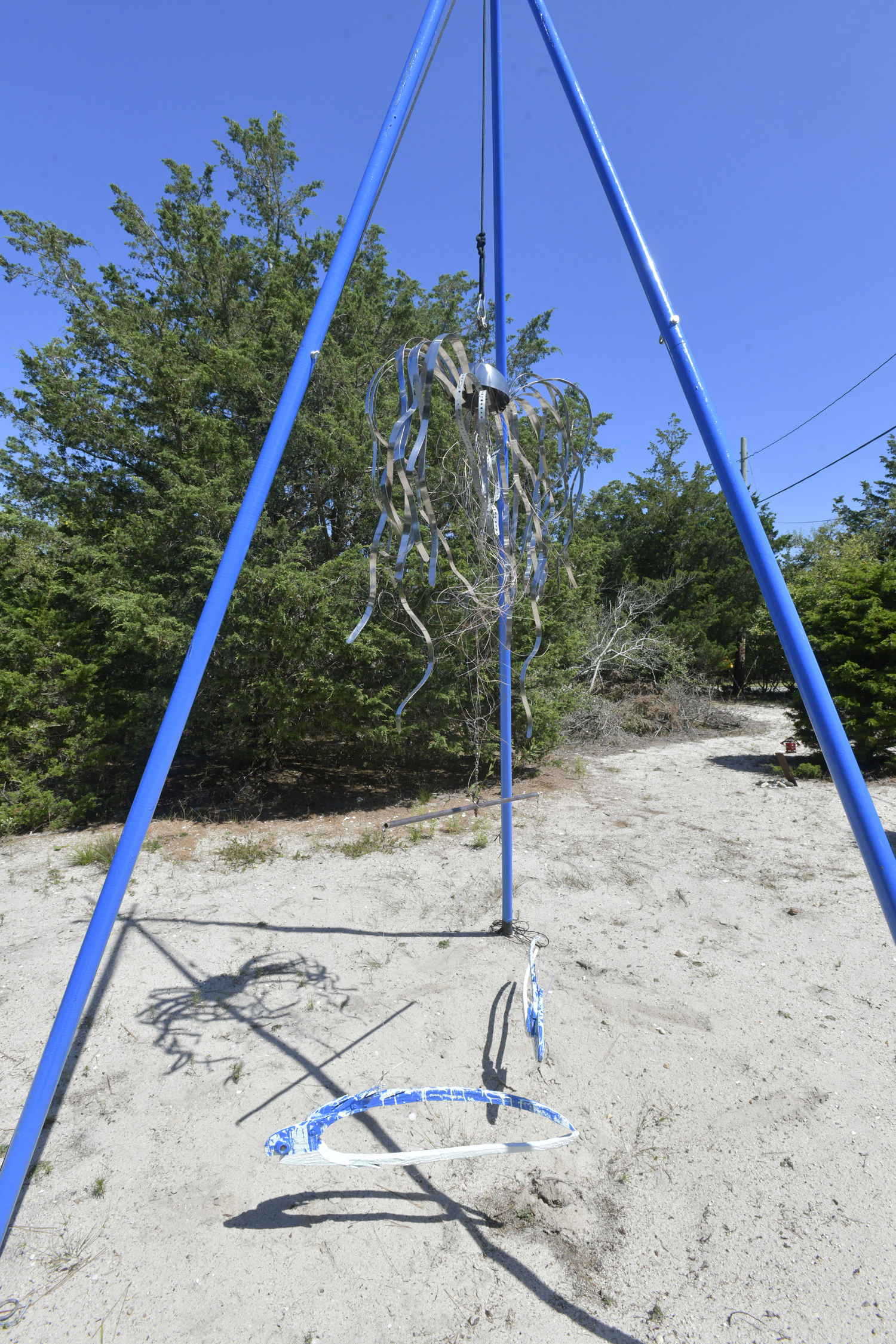 The front yard could be considered an outdoor art gallery where Dixon’s fish mobiles sway gently with the wind. The collection of colorful objects represent the marine life that Dixon craves, from fish to sailboats.  DANA SHAW