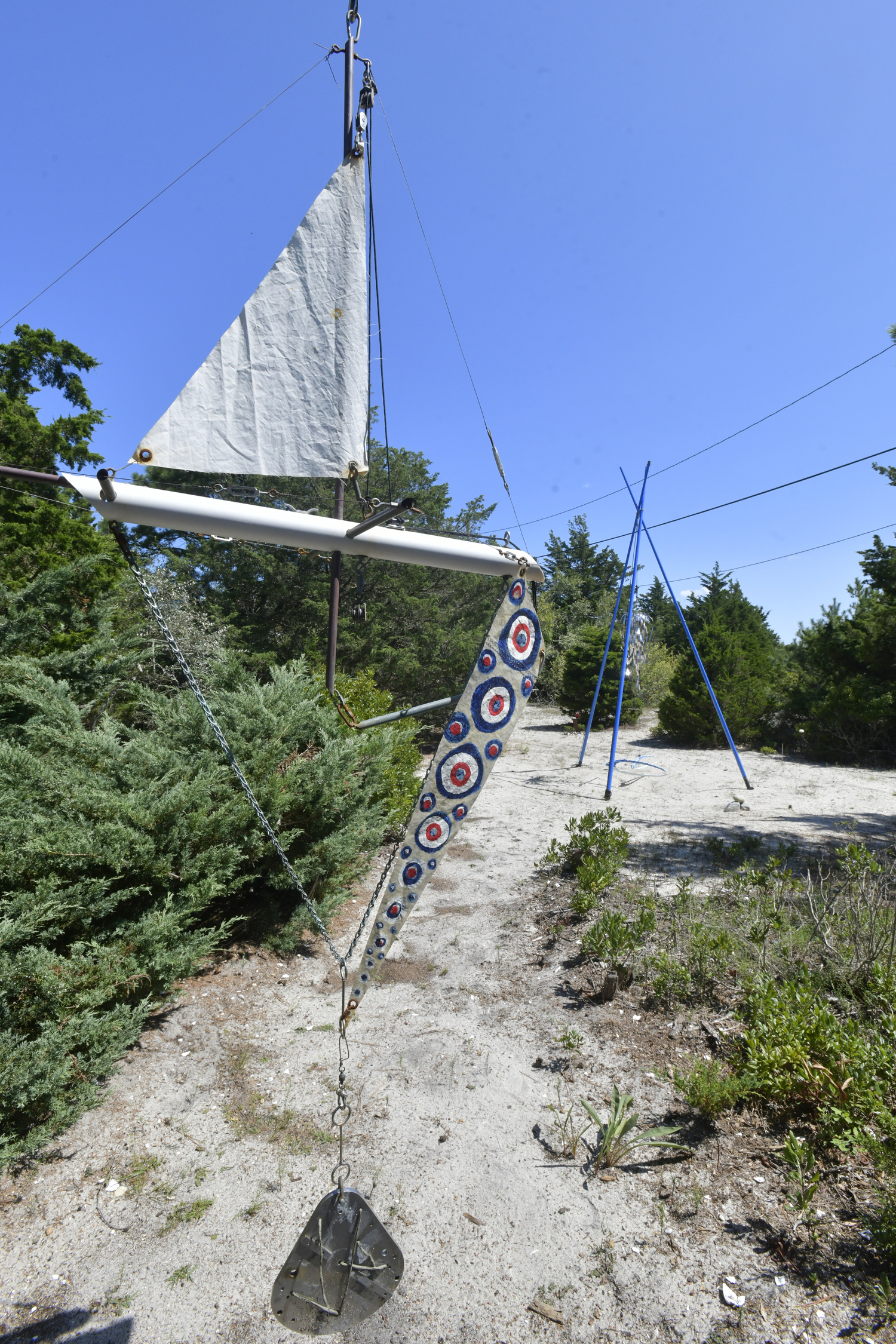 The front yard could be considered an outdoor art gallery where Dixon’s fish mobiles sway gently with the wind. The collection of colorful objects represent the marine life that Dixon craves, from fish to sailboats.  DANA SHAW