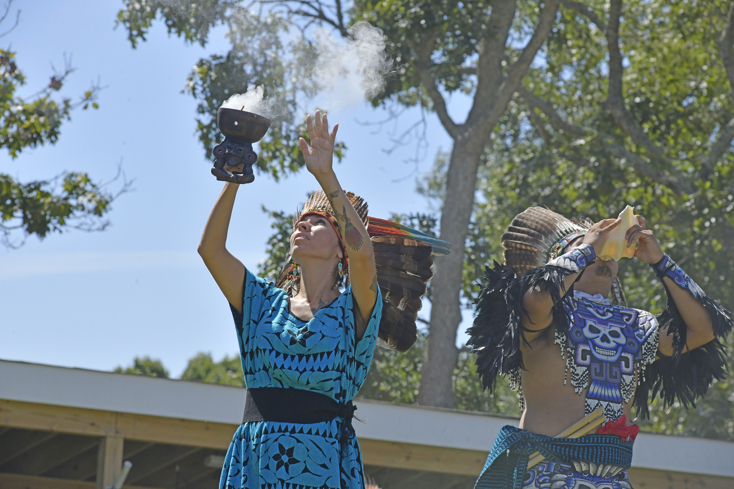 Members of Kalpulli Huehuetlatolli, Aztec dancers and drummers, perform at the Powwow on Saturday.