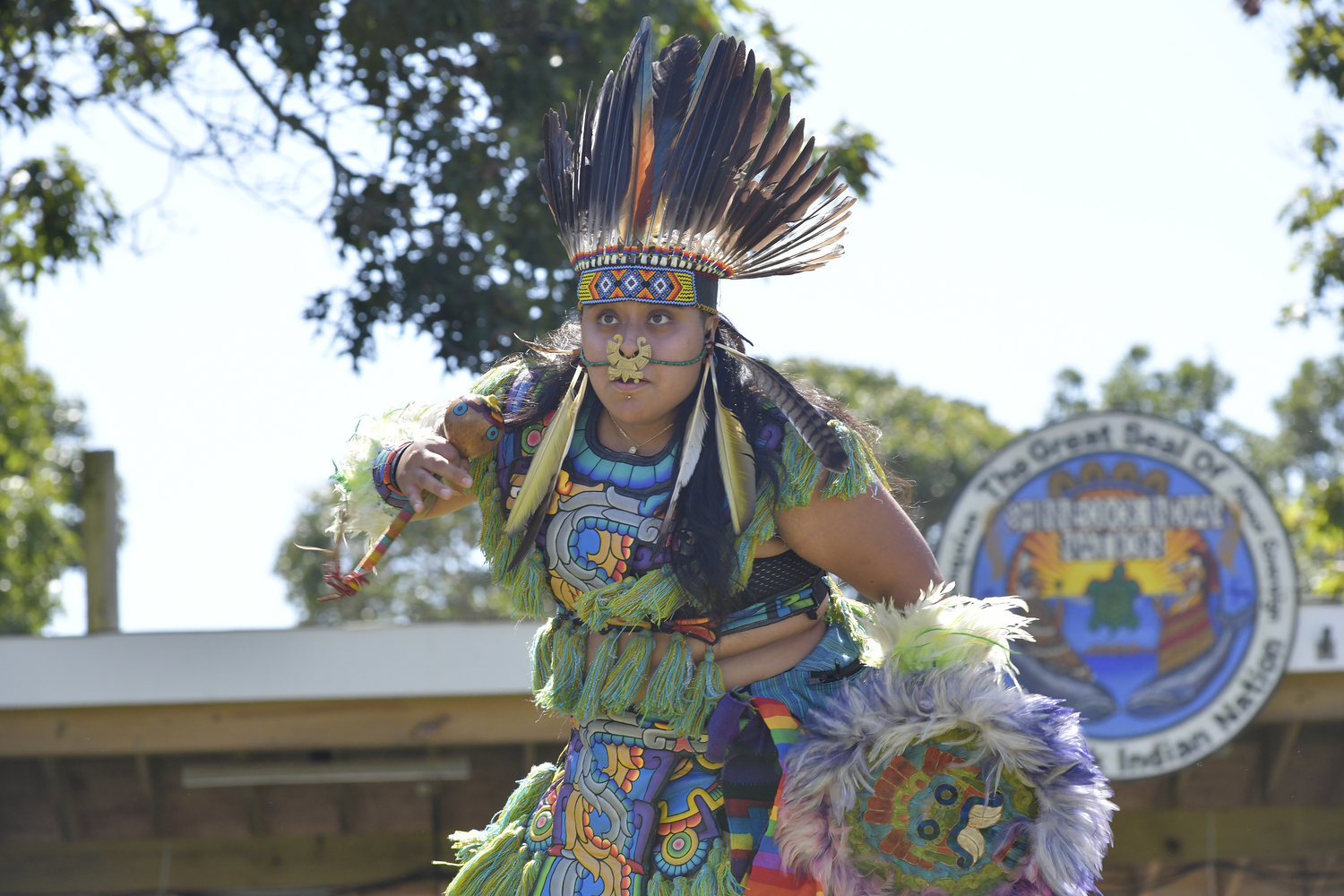 Members of Kalpulli Huehuetlatolli, Aztec dancers and drummers, perform at the Powwow on Saturday.