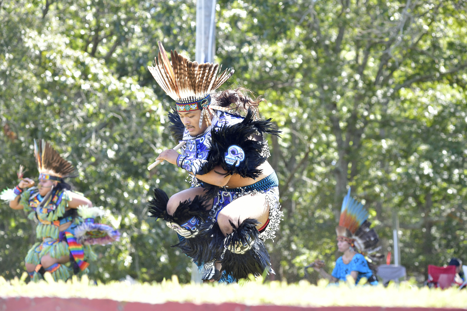 Members of Kalpulli Huehuetlatolli, Aztec dancers and drummers, perform at the Powwow on Saturday.