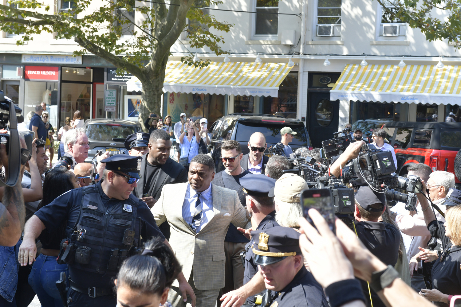 Justin Timberlake makes his way through the media scrum on his way to Sag Habor Village Justice Court on Friday morning.    DANA SHAW