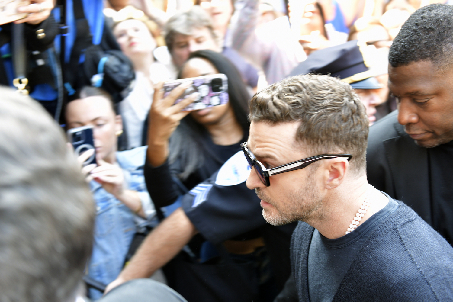 Justin Timberlake makes his way through the media scrum on his way to Sag Habor Village Justice Court on Friday morning.    DANA SHAW