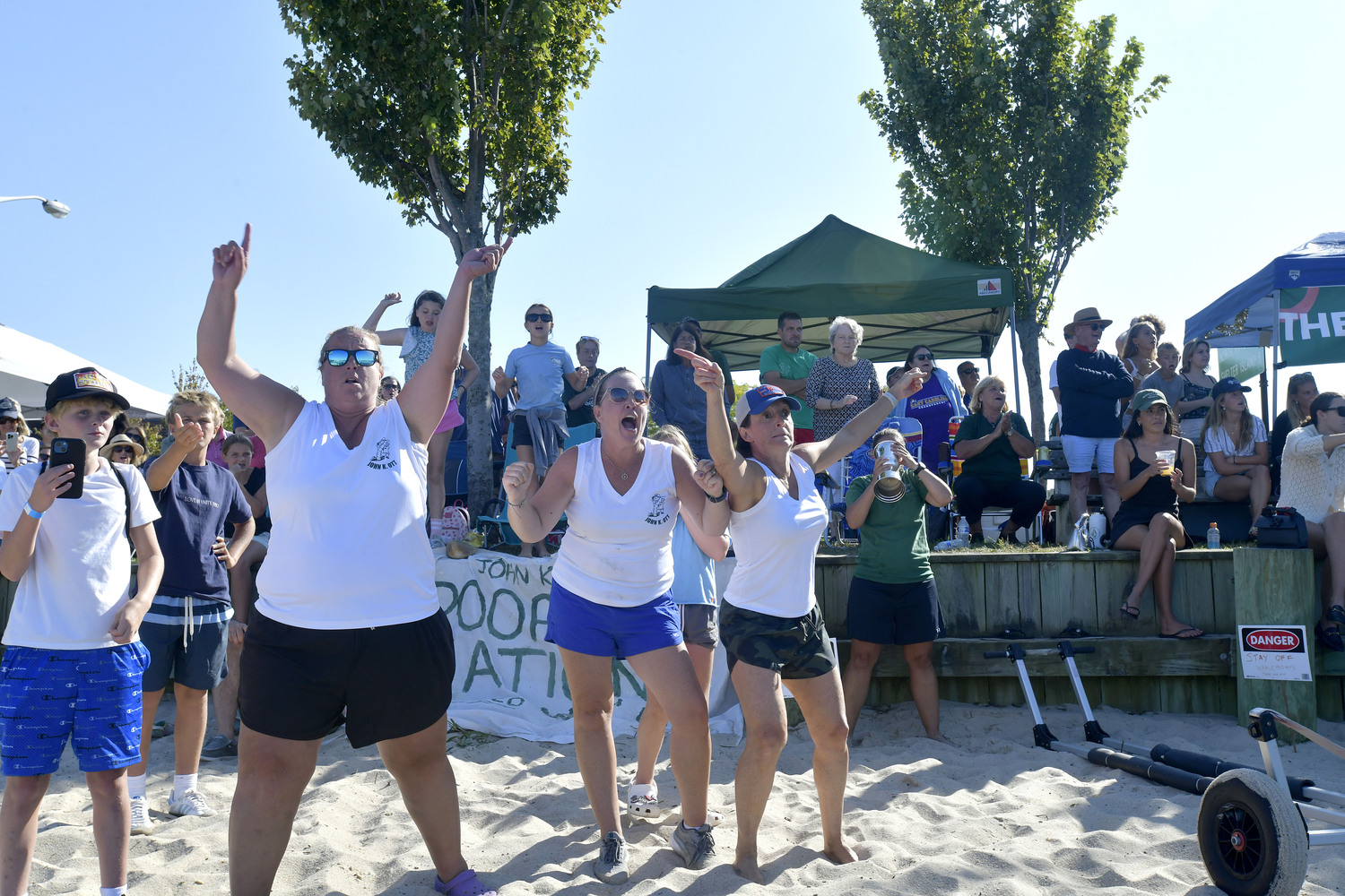 The John K. Ott Women's Whaleboat team cheers on the men's team during the Whaleboat Championship on Sunday afternoon.