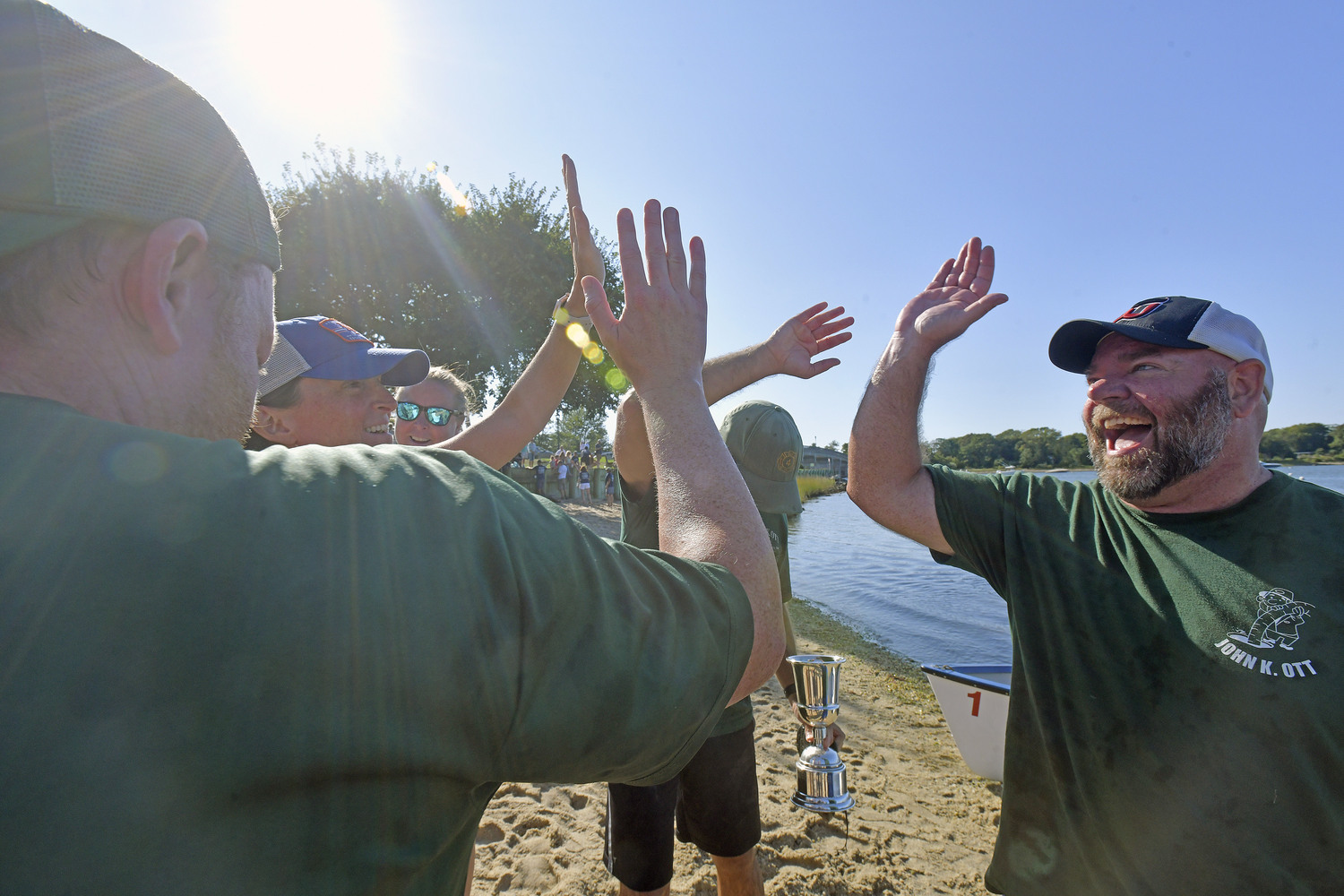 The John K. Ott Men's Whaleboat team celebrates after securing the Championship once again.   DANA SHAW