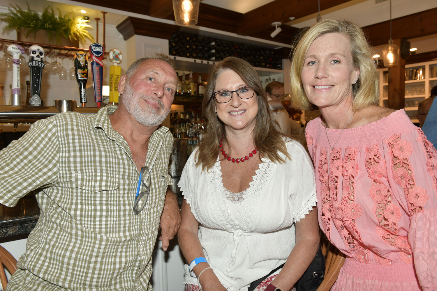 George and Lisa Hastings with Jean Curran at the Hampton Bays Rotary Club’s 17th Annual “Autumn Evening by the Sea” Fundraiser at Oakland's on September 19.  DANA SHAW