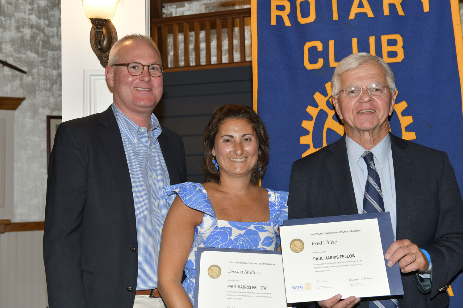 East Quogue resident Jessica Stalters, center, and Fred W. Thiele Jr., right, were honored by the Rotary Club of Hampton Bays on September 19 for their contributions to the community. Ms. Stalters received the Paul Harris Fellow award and Assemblyman Thiele received the 