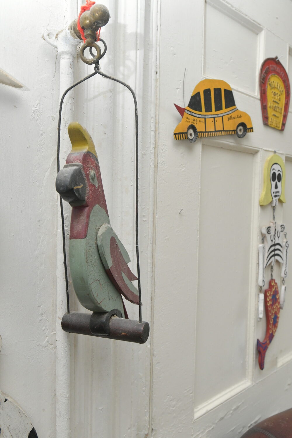 Items from Joan Tyor Carlson's  extensive collection of small painted wooden cut-outs of figures and signs.   DANA SHAW