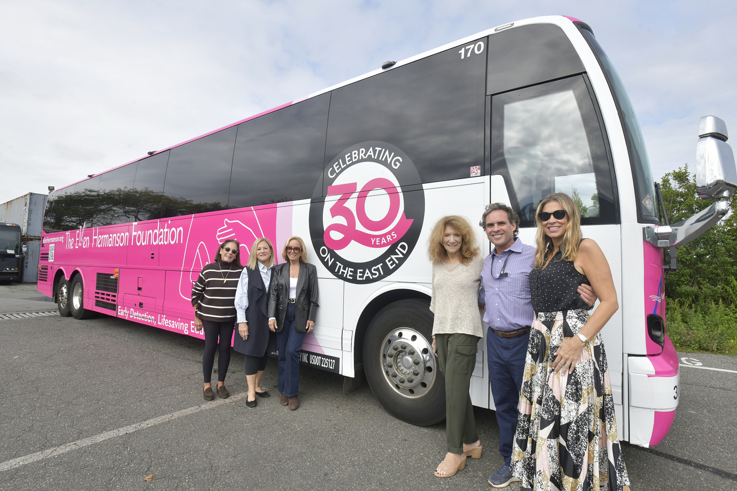 Mady Schuman, executive director of The Ellen Hermanson Foundation; board members Cathy Tweedy and Ann Ciardullo; Julie Ratner, co-founder and chairwoman of The Ellen Hermanson Foundation; Geoffrey Lynch, president of the Hampton Jitney and board member Amanda Star Frazer with the Ambassador bus celebrating the Ellen Hermanson Foundation's 30 years on the East End.  DANA SHAW