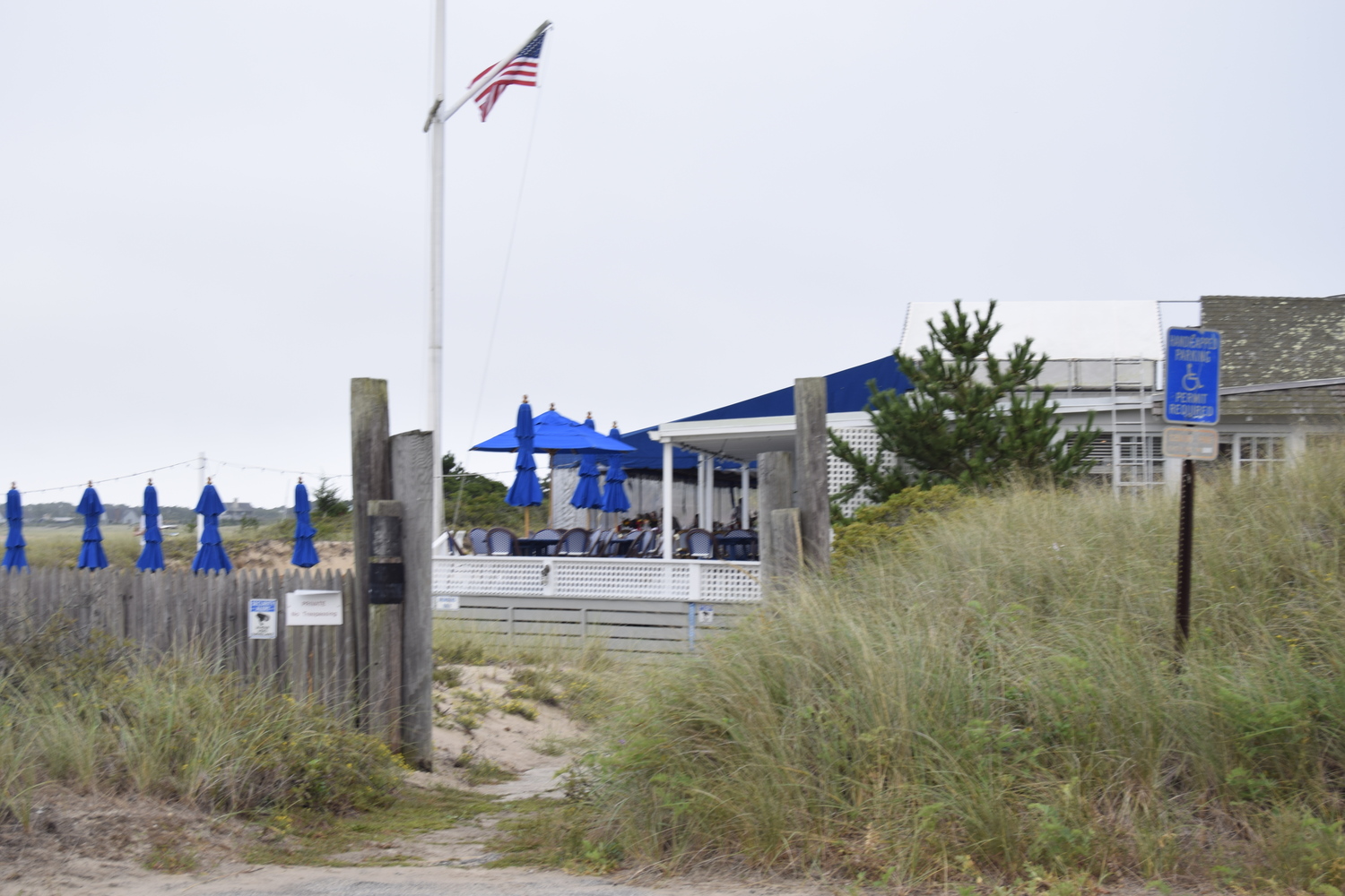 In a first phase of planned upgrades, the Devon Yacht Club's clubhouse would be demolished and reconstructed farther from the dune crest. CHRISTOPHER WALSH