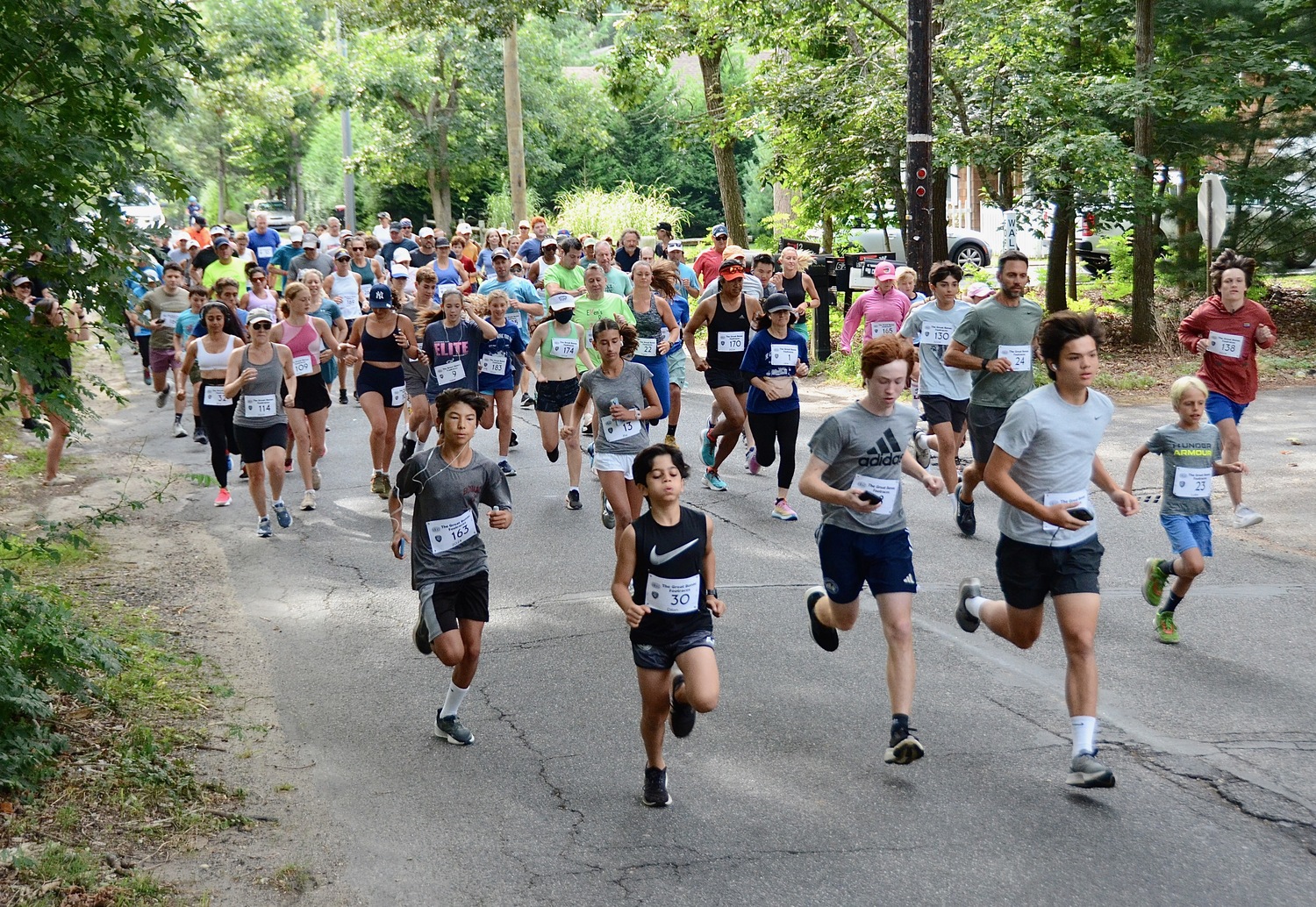 Runners start the Great Bonac Footraces on Labor Day morning in Springs.   KYRIL BROMLEY