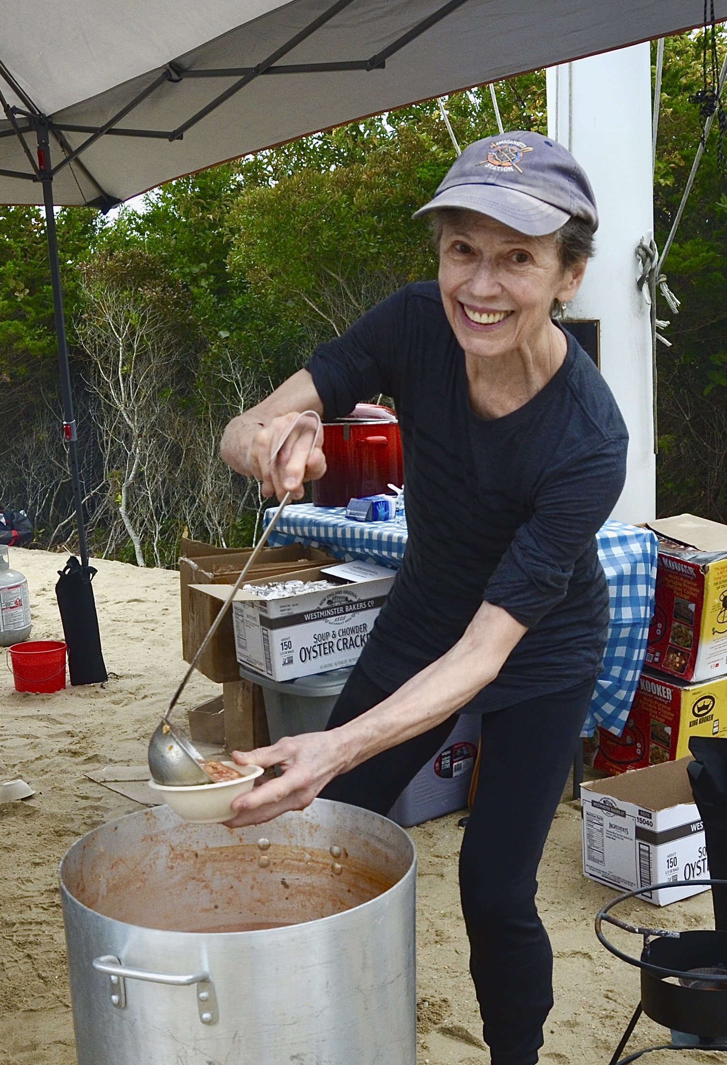 Isabel Carmichael ladling out the chowder at the East Hampton Trustees largest clam Contest on Sunday.   KYRIL BROMLEY