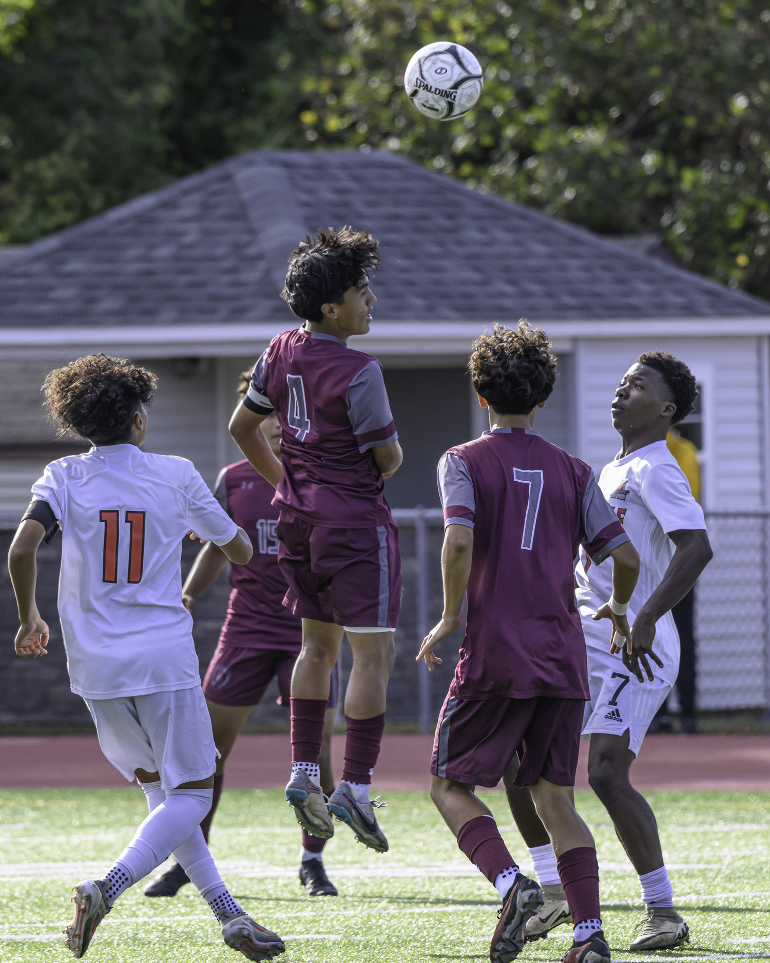 East Hampton senior captain Jonathan Armijos heads the ball.   MARIIANE BARNETT